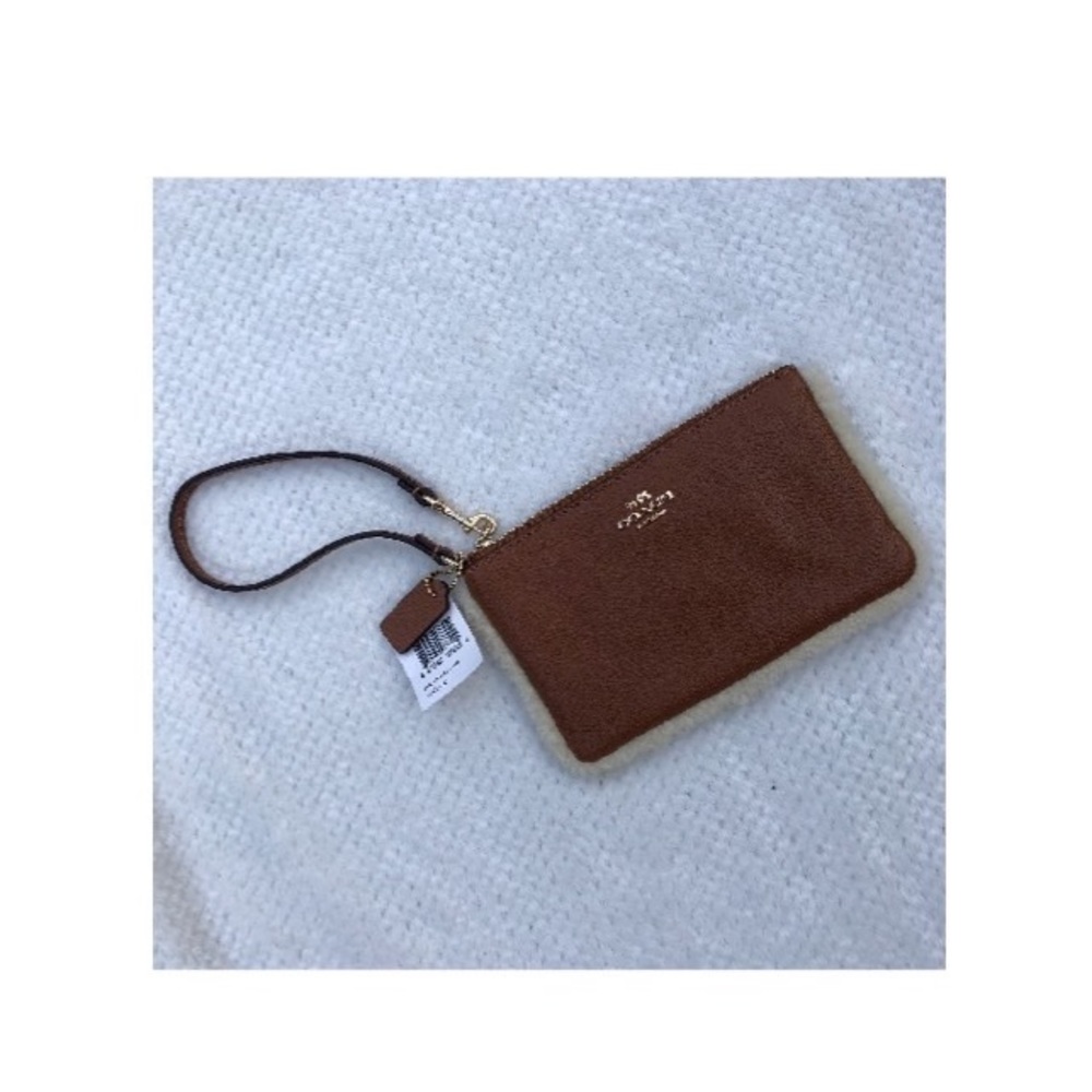 Coach saddle brown leather wristlet w/ fur trim